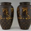 A pair of Art Deco ceramic vases with birds.