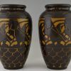 A pair of Art Deco ceramic vases with birds.