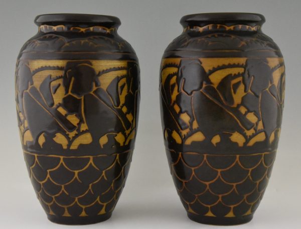 A pair of Art Deco ceramic vases with birds.
