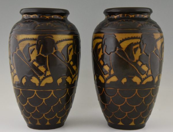 A pair of Art Deco ceramic vases with birds.