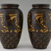 A pair of Art Deco ceramic vases with birds.