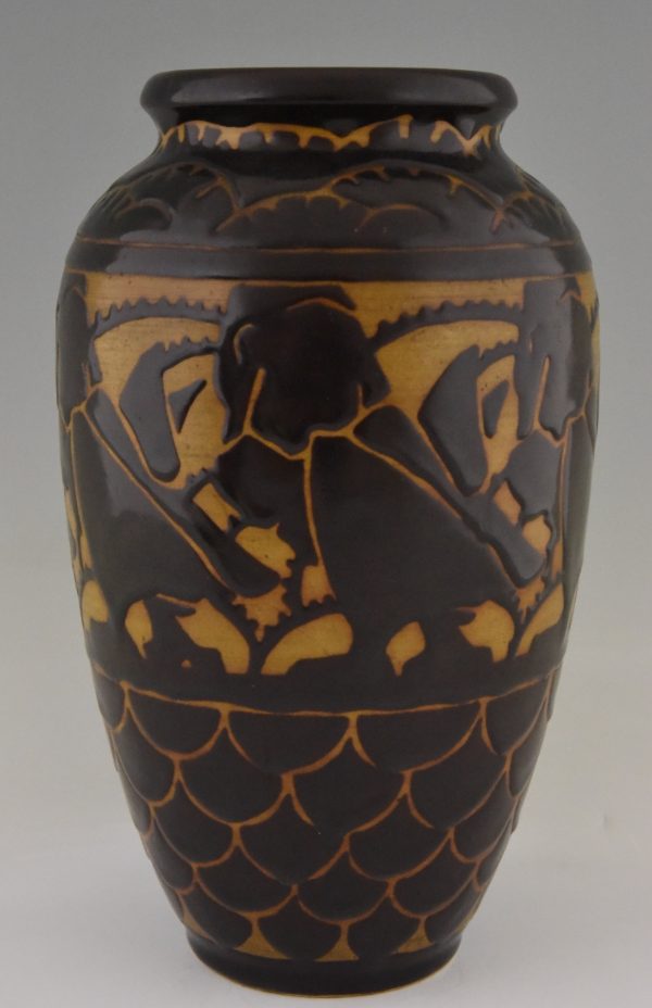 A pair of Art Deco ceramic vases with birds.