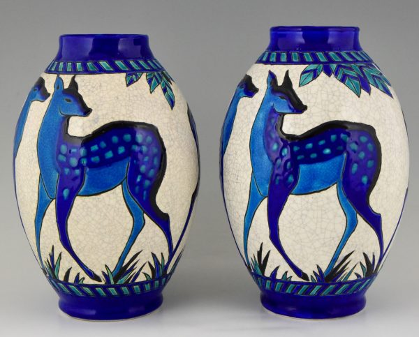 Pair Art Deco craquelé ceramic vases with blue deer