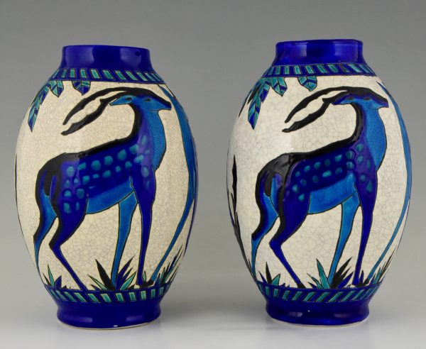 Pair Art Deco craquelé ceramic vases with blue deer