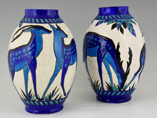 Pair Art Deco craquelé ceramic vases with blue deer