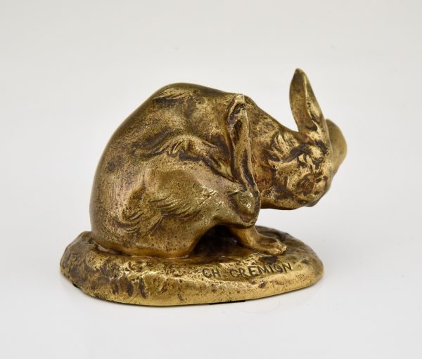 Antique bronze sculpture of a hare washing