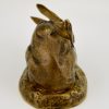 Antique bronze sculpture of a hare washing