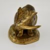 Antique bronze sculpture of a hare washing