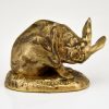 Antique bronze sculpture of a hare washing