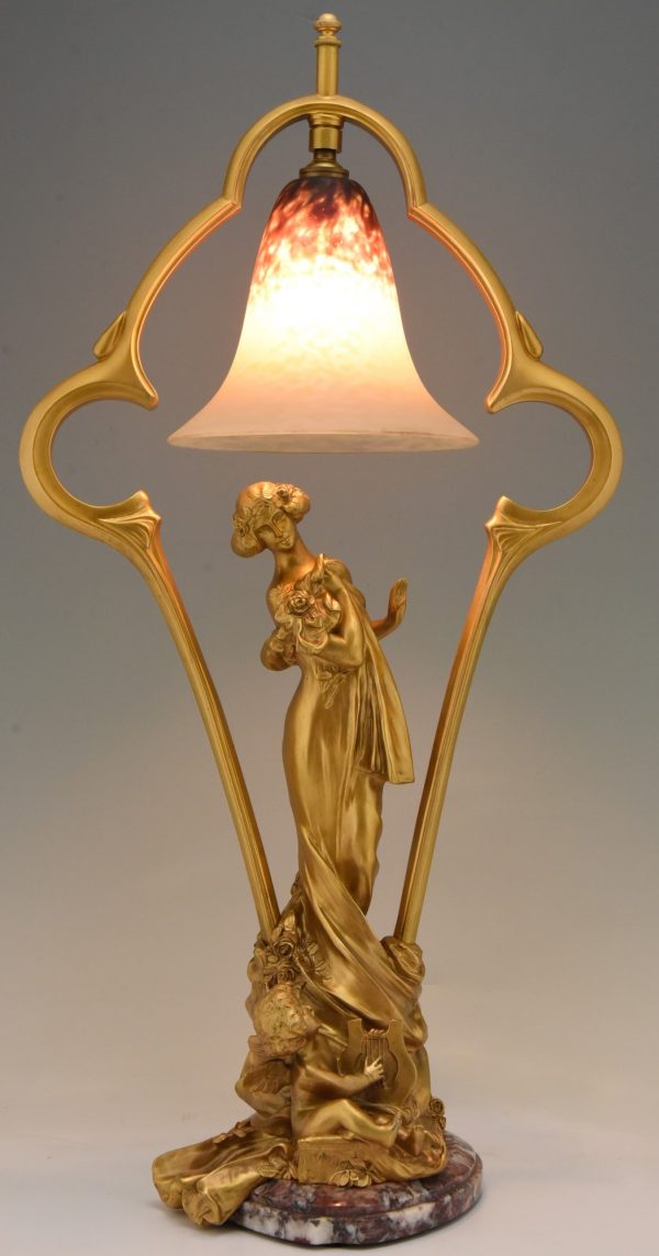 Art Nouveau gilt bronze lamp with lady and cupid