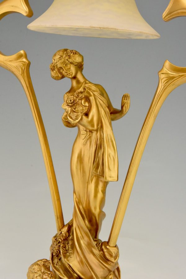 Art Nouveau gilt bronze lamp with lady and cupid