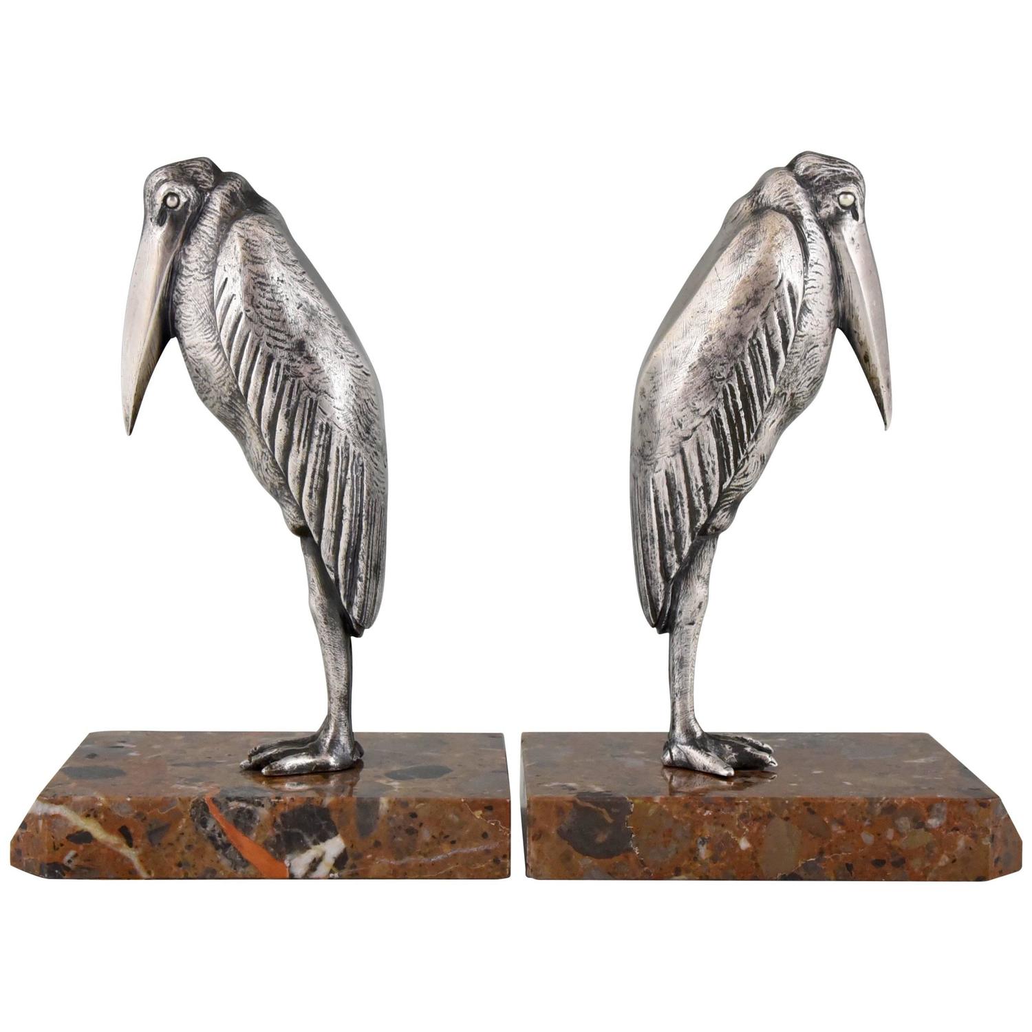 Serre livres Art Deco bronze argenté marabout Serre livres Art Deco bronze argenté marabout