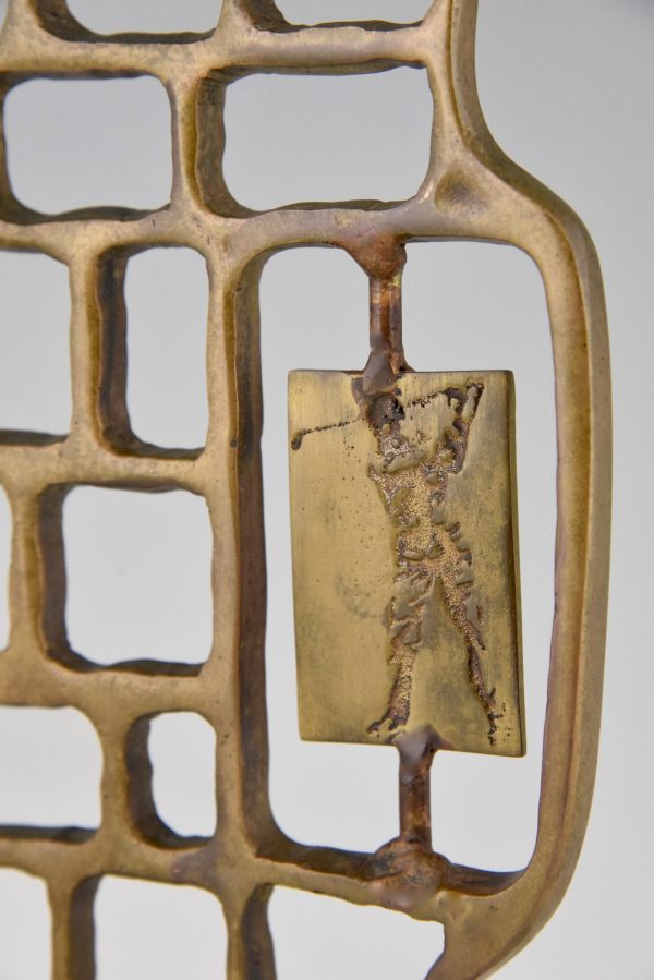 Modern abstract bronze sculpture with golfer