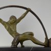 Art Deco sculpture athletic man bending a bar