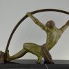 Art Deco sculpture athletic man bending a bar