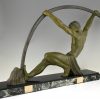 Art Deco sculpture “l’age du bronze” homme avec barre