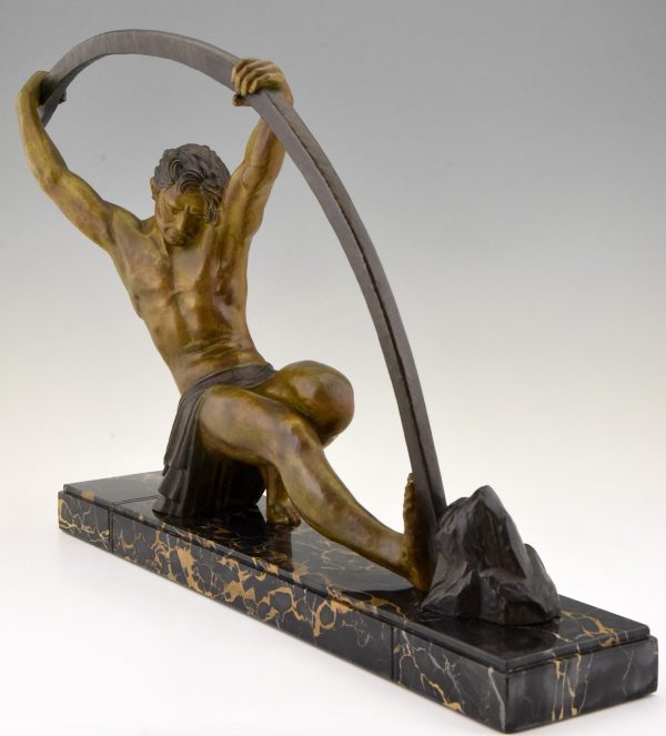 Art Deco sculpture “l’age du bronze” homme avec barre