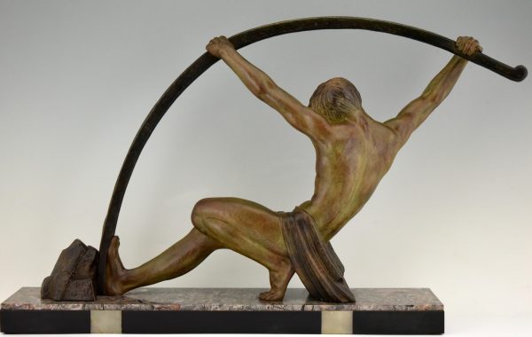 Art Deco sculpture “l’age du bronze” homme avec barre