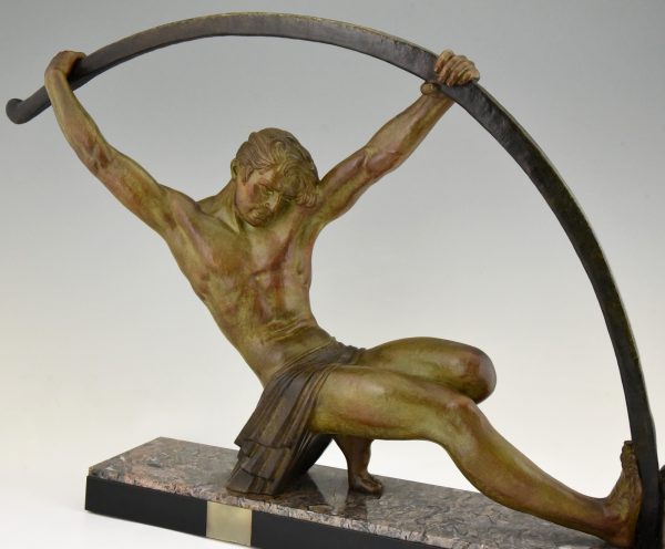 Art Deco sculpture “l’age du bronze” homme avec barre