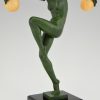 Art Deco sculpture of a nude dancer with balls