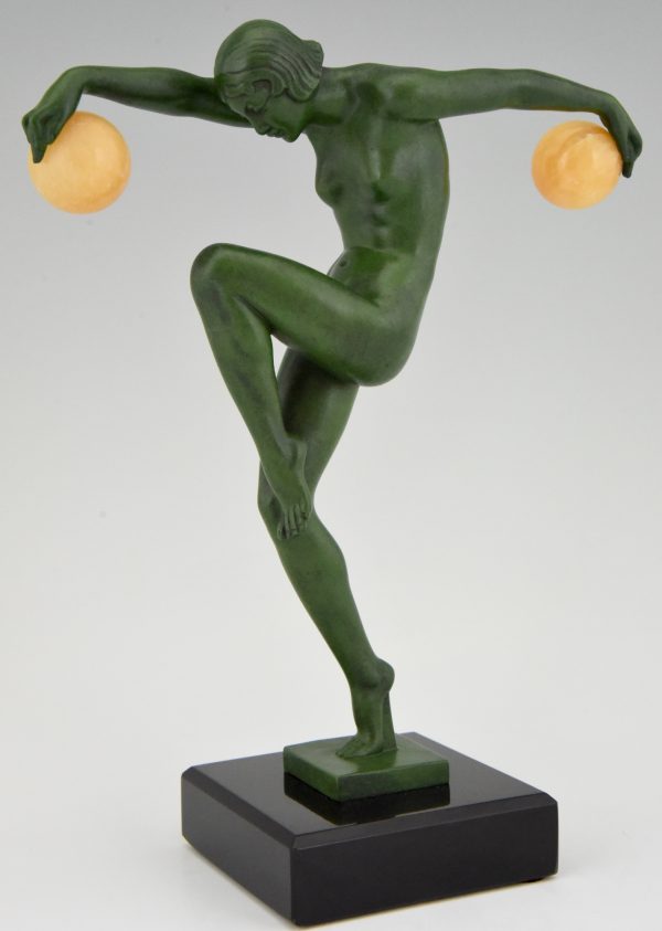 Art Deco sculpture of a nude dancer with balls