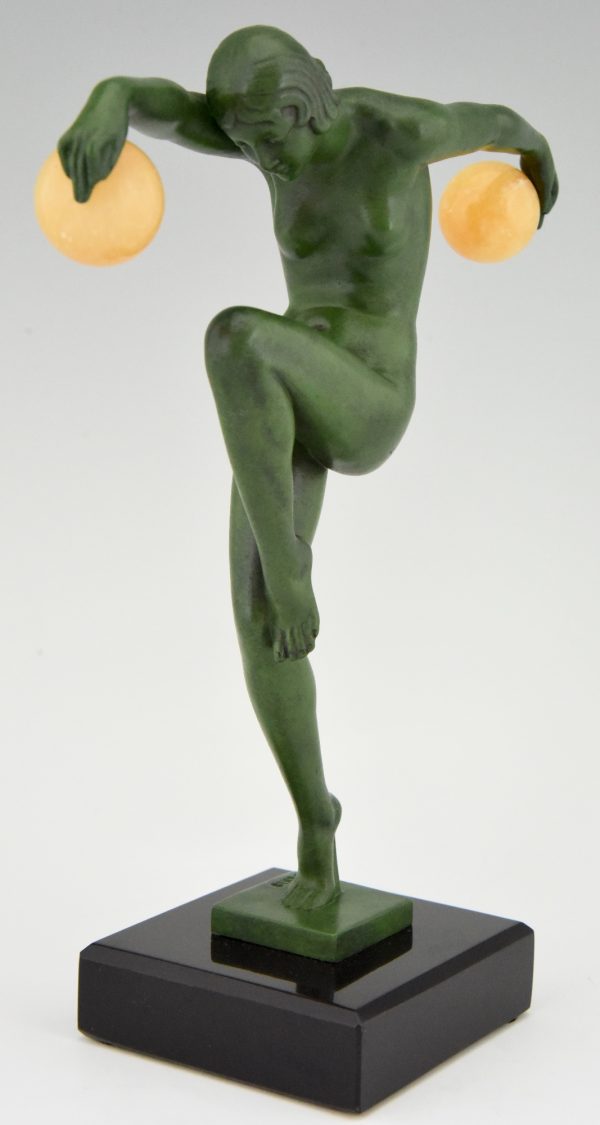 Art Deco sculpture of a nude dancer with balls