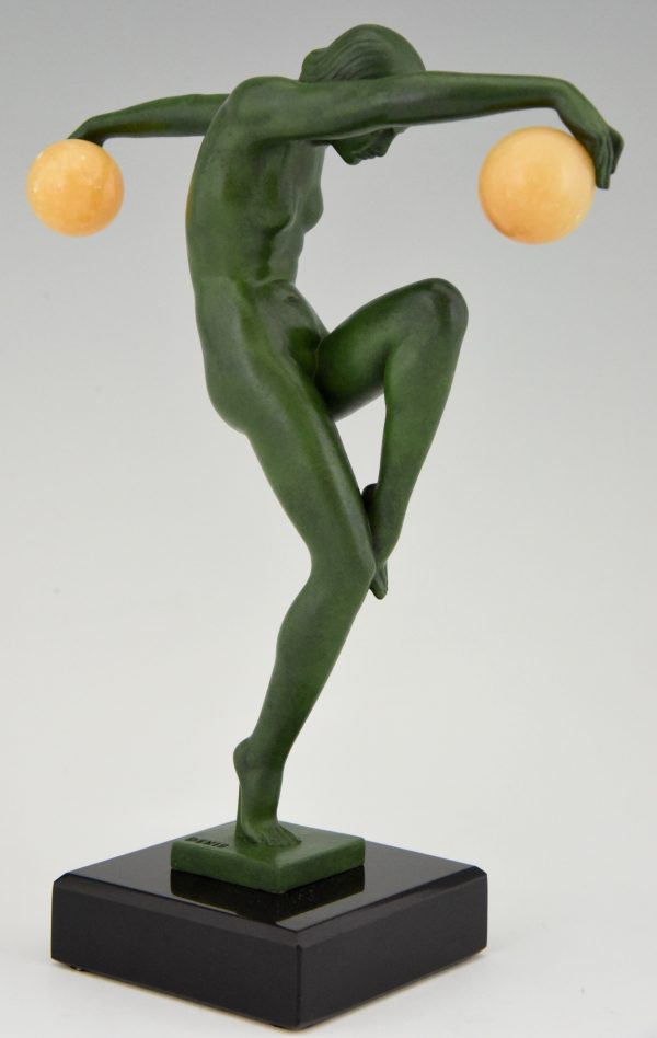 Art Deco sculpture of a nude dancer with balls