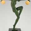 Art Deco sculpture of a nude dancer with balls