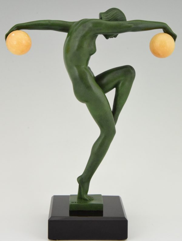 Art Deco sculpture of a nude dancer with balls