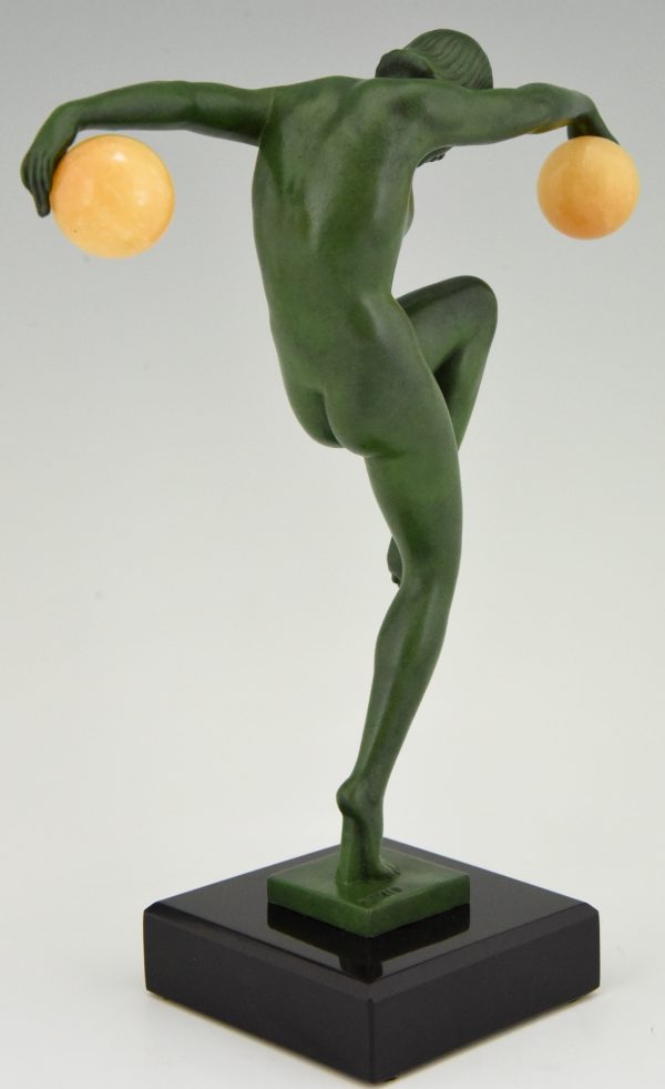 Art Deco sculpture of a nude dancer with balls