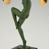 Art Deco sculpture of a nude dancer with balls