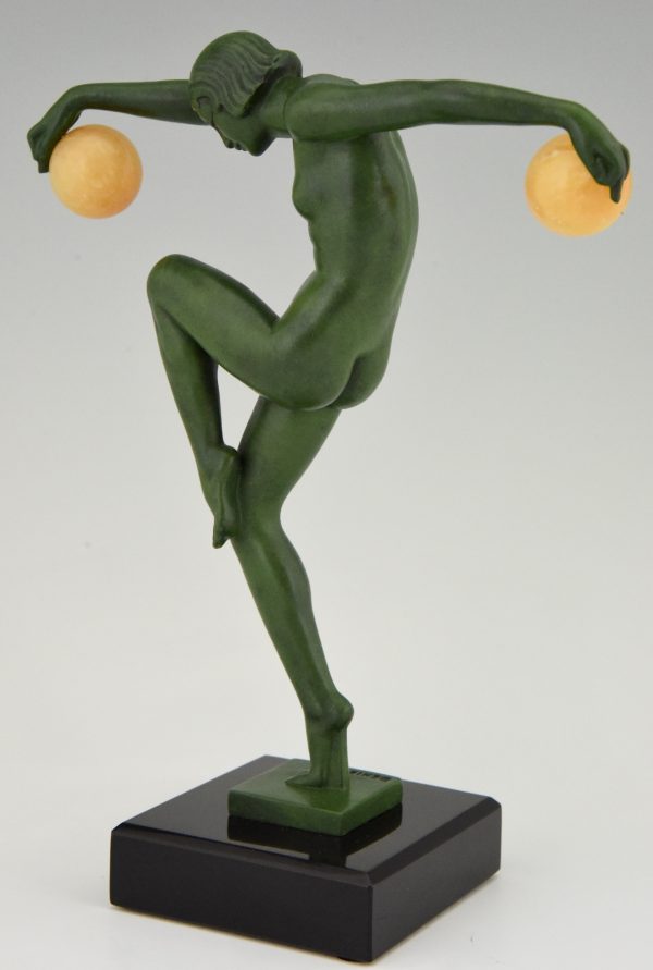 Art Deco sculpture of a nude dancer with balls