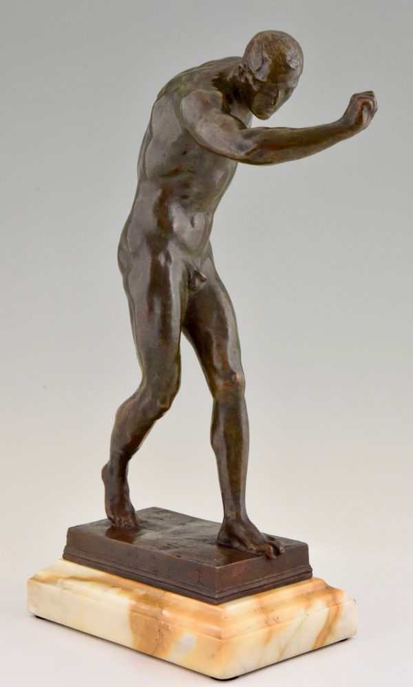 Antique bronze sculpture of a male nude athlete