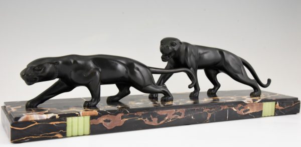 Art Deco bronze sculpture of two panthers