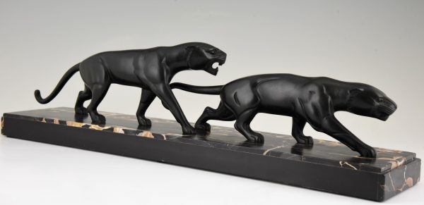 Art Deco bronze sculpture of two panthers