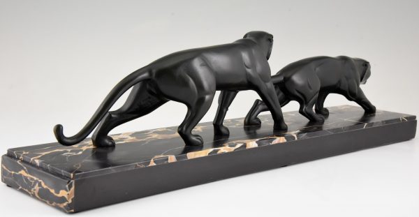 Art Deco bronze sculpture of two panthers