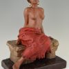 Art Nouveau sculpture of a seated nude with removable skirt.