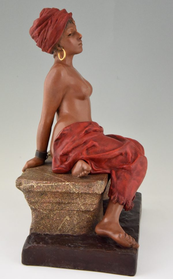 Art Nouveau sculpture of a seated nude with removable skirt.