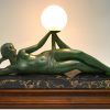 Aube Art Deco lamp draped nude holding a glass globe