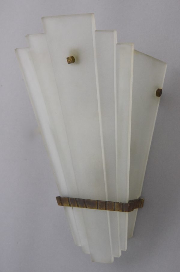 A pair of Art Deco glass and bronze wall lights or sconces