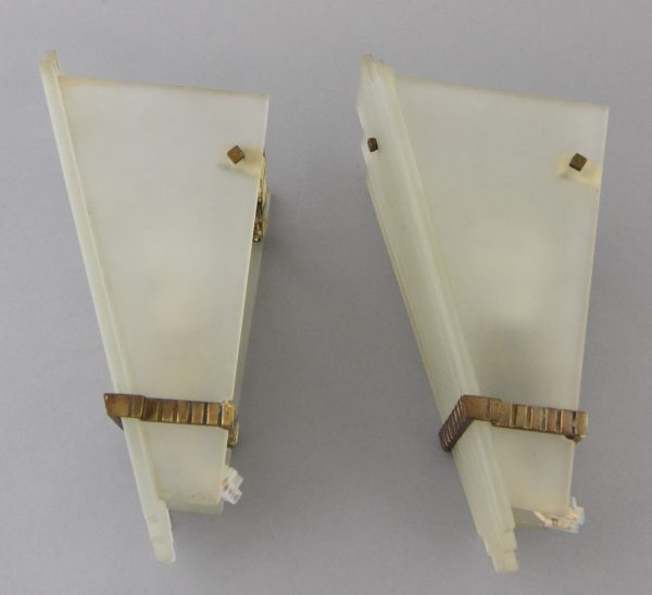 A pair of Art Deco glass and bronze wall lights or sconces