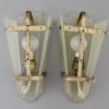 A pair of Art Deco glass and bronze wall lights or sconces