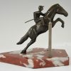 Art Deco bookends jockey on jumping horse.