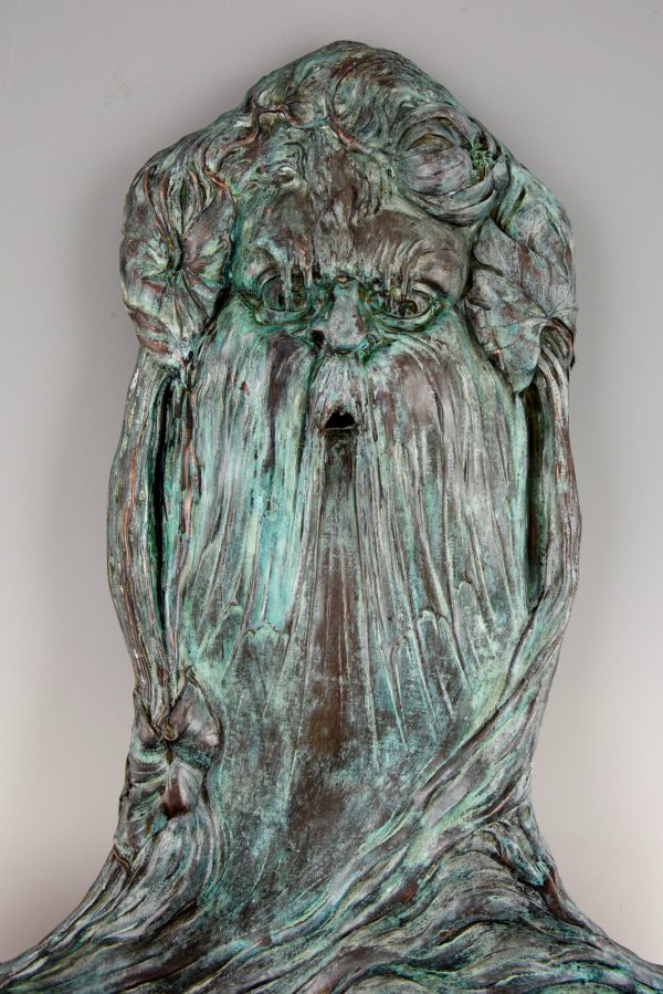 Art Nouveau fountain with face of Neptune