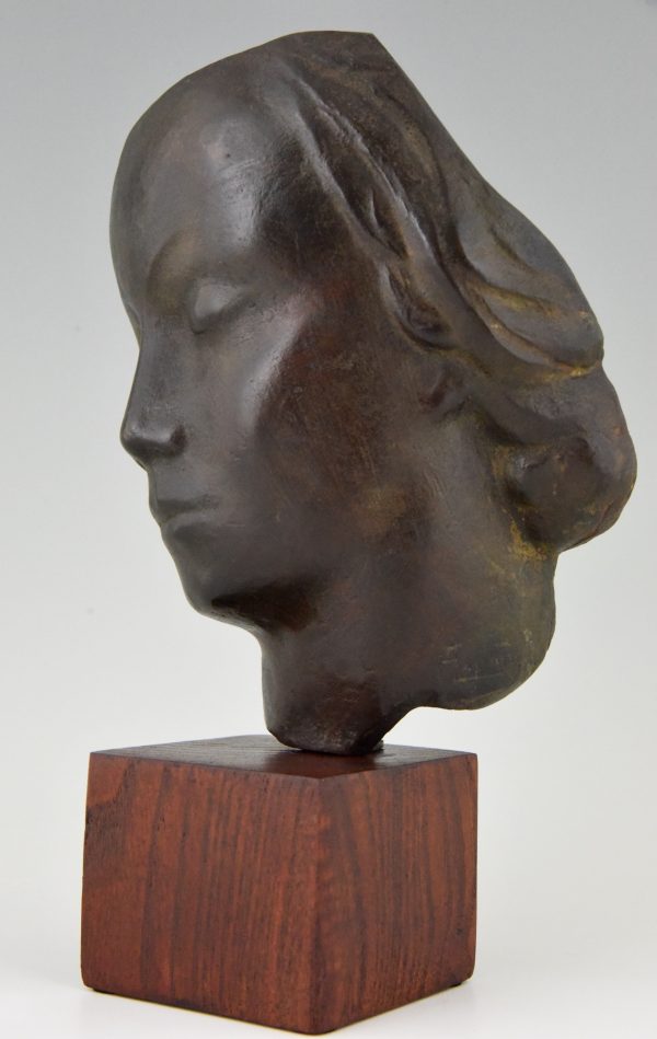 Art Deco bronze sculpture of a woman’s face