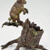 Antique Vienna bronze bear on a tree trunk