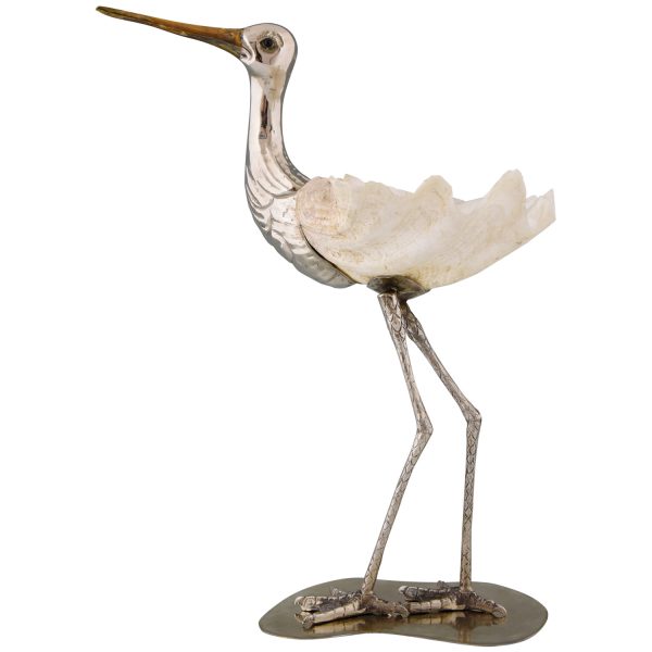 Modern sculpture of a bird silvered metal and seashell