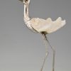 Modern sculpture of a bird silvered metal and seashell