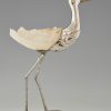 Modern sculpture of a bird silvered metal and seashell