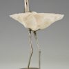 Modern sculpture of a bird silvered metal and seashell